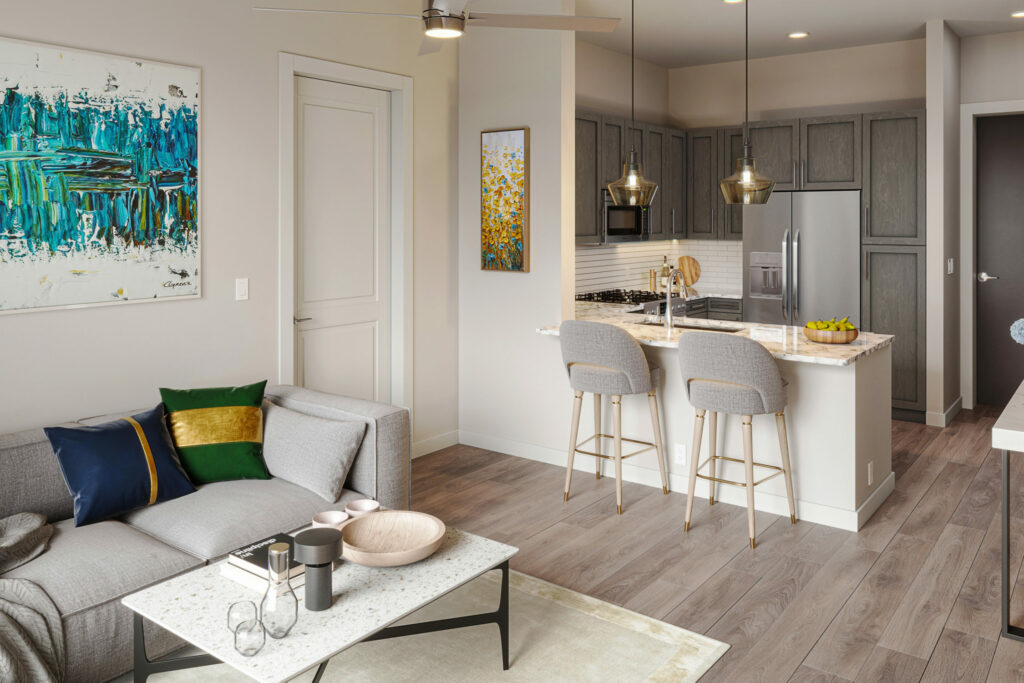Put Comfort at Your Fingertips - Open floorplan featuring a spacious living area with a gourmet kitchen in the background.